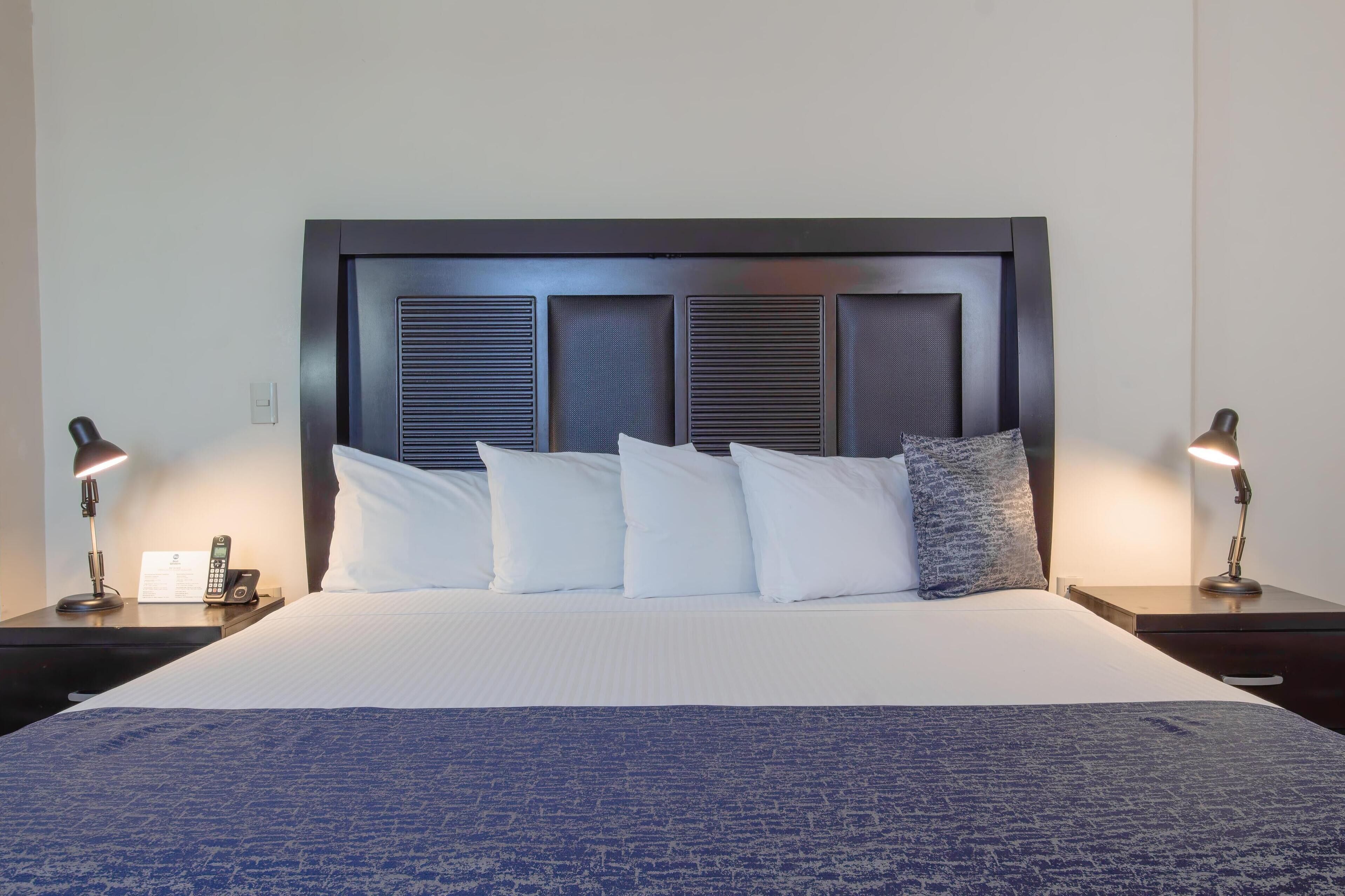 suite, 1 king bed, non smoking | minibar, desk, iron/ironing board, bed sheets