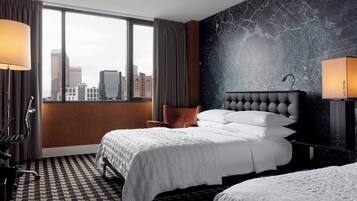 Ropa de cama de alta calidad y caja de seguridad en la habitación