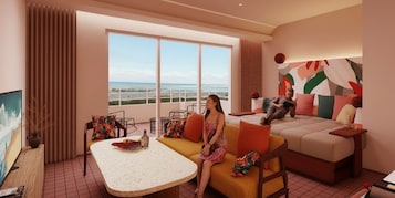 Una habitación de hotel moderna con un balcón grande, un sofá, una mesa y una cama.