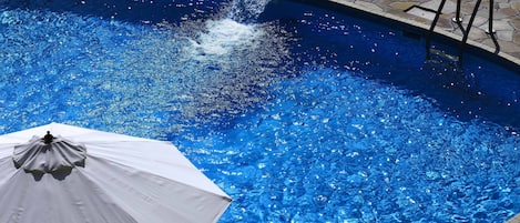 Seasonal outdoor pool, pool umbrellas, pool loungers