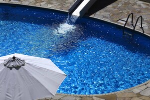Outdoor pool, open 9:00 AM to 6:30 PM, pool umbrellas