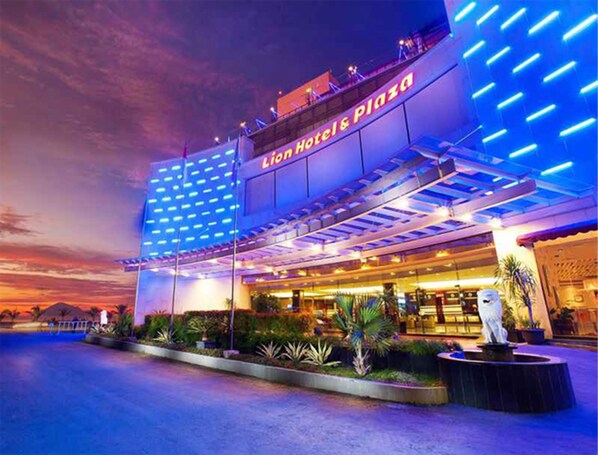 The exterior of the Lion Hotel & Plaza with a modern design, featuring a prominent sign and a well-lit facade. - Lion Hotel & Plaza (Manado)