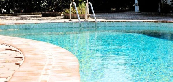 Outdoor pool, pool umbrellas, pool loungers
