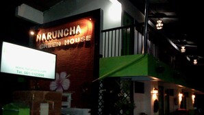 A building with a sign reading "Naruncha Green House." - Naruncha Green House (Chiang Mai)