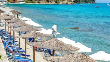 On the beach, sun loungers, beach umbrellas