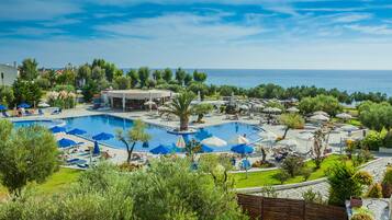 Indoor pool, outdoor pool, pool umbrellas, pool loungers