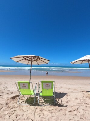 On the beach, sun loungers, beach umbrellas, beach towels