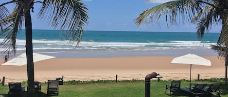 On the beach, sun loungers, beach umbrellas, beach towels