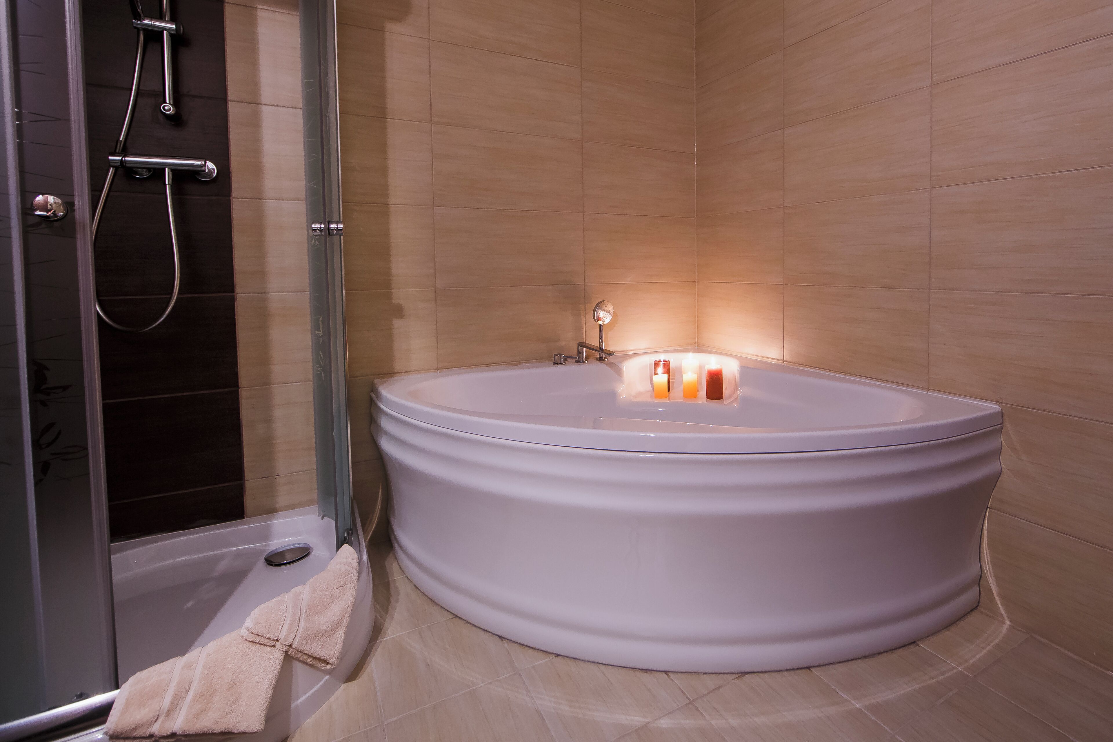 classic studio suite | bathroom | shower, hair dryer, towels