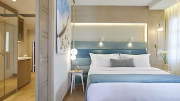 A modern hotel room with a large bed, bedside lamps, a small side table, and a mirror.