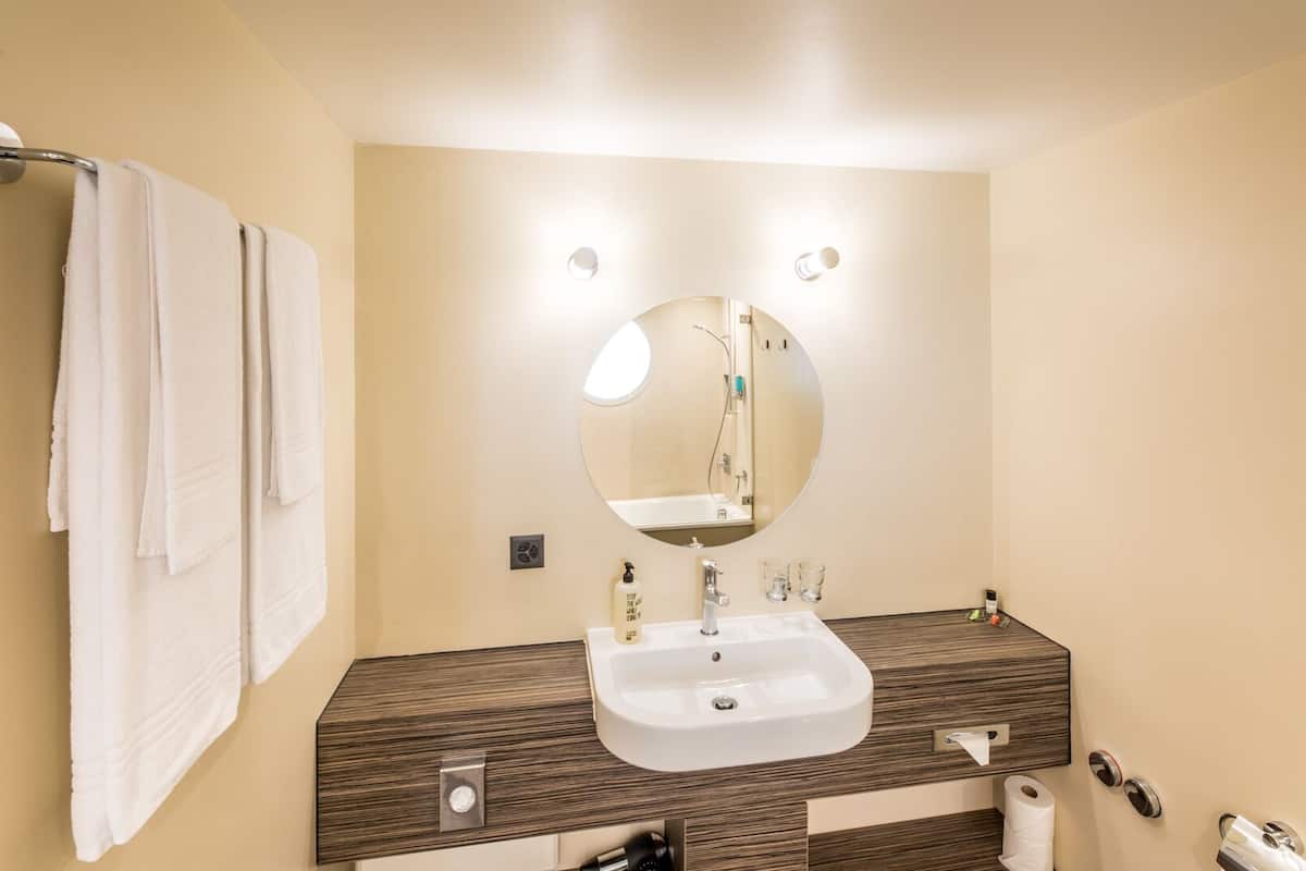 superior double room | bathroom | hair dryer, towels