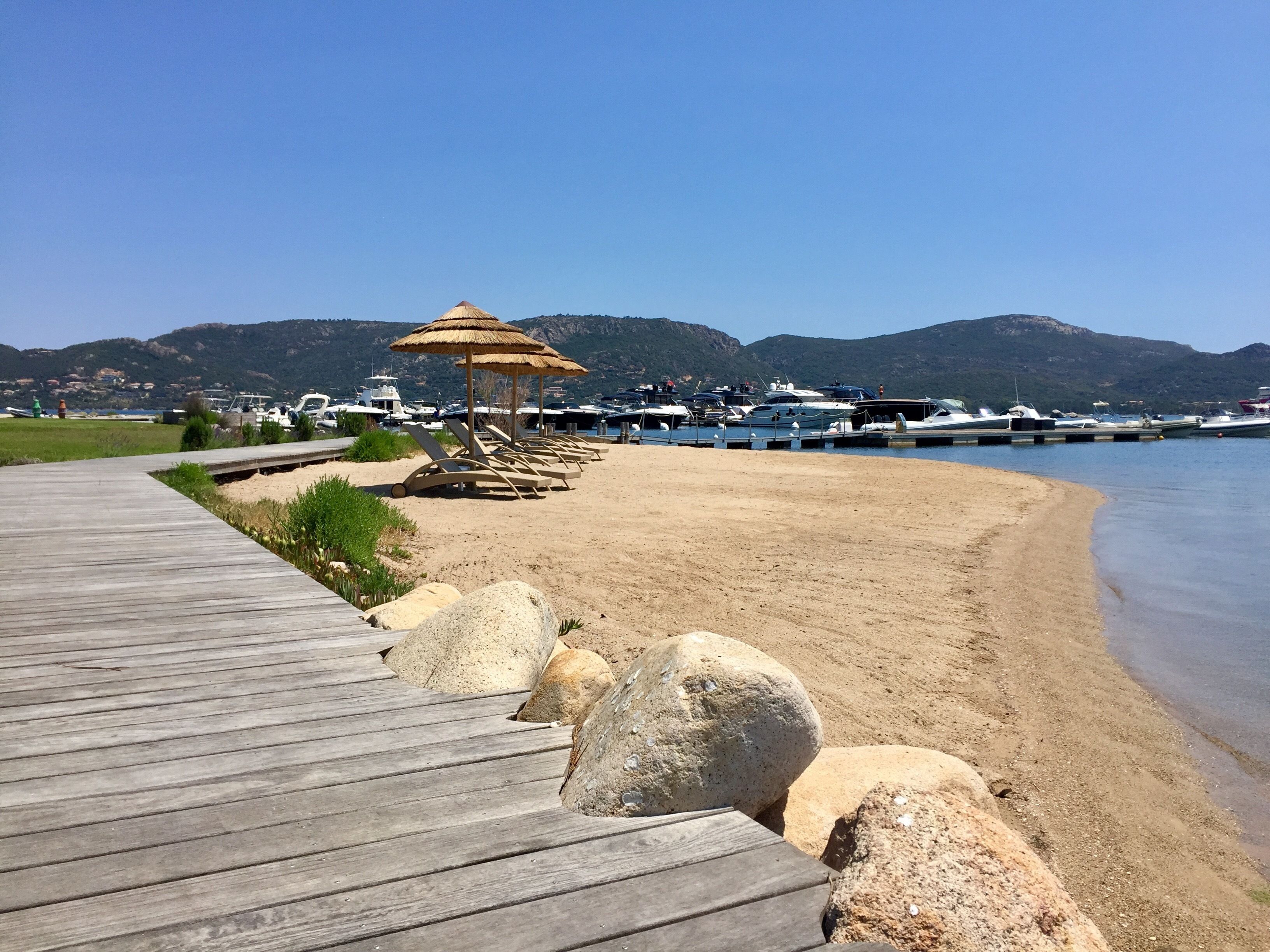 sun-loungers, beach umbrellas, beach towels, waterskiing
