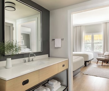 Suite, 1 Bedroom | Bathroom | Combined shower/tub, designer toiletries, hair dryer, bathrobes at Kimpton Brice Hotel by IHG