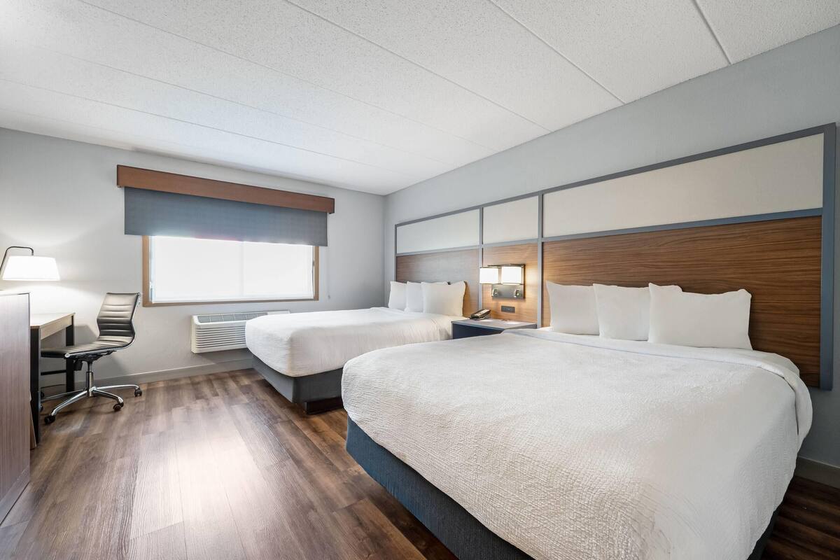 Room, 2 Queen Beds, Non Smoking (Pet Friendly) | In-room safe, desk, laptop workspace, blackout drapes