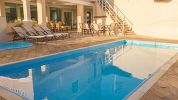 Outdoor pool, open 9 AM to 8 PM, pool umbrellas, pool loungers