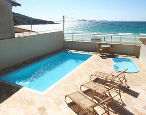 Outdoor pool, open 9 AM to 8 PM, pool umbrellas, sun loungers