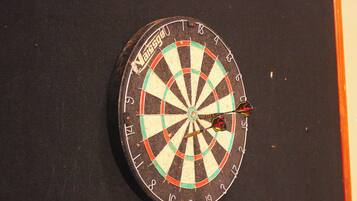 A dartboard with a dart in the bullseye.