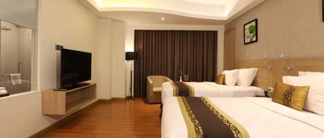Junior Suite, 1 Bedroom, City View | Minibar, in-room safe, desk, iron/ironing board