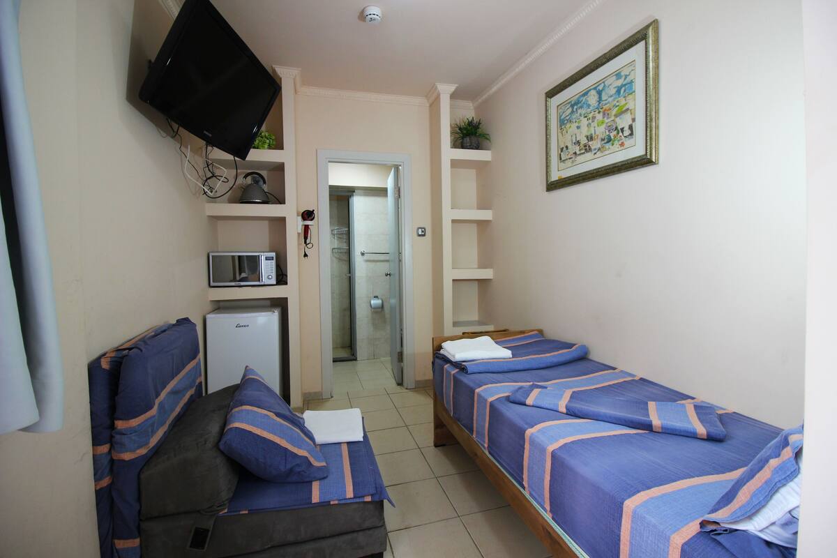Single Room | Pillow-top beds, minibar, individually decorated, individually furnished