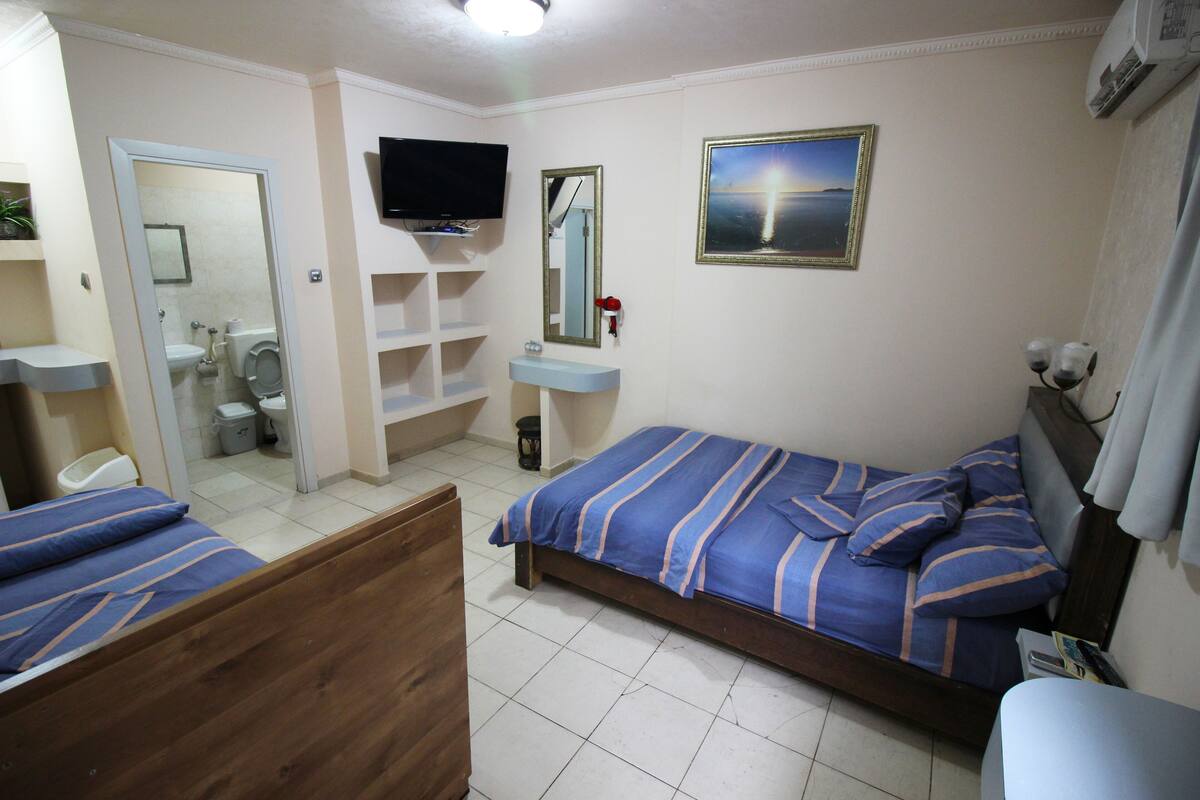 Triple Room | Pillow-top beds, minibar, individually decorated, individually furnished