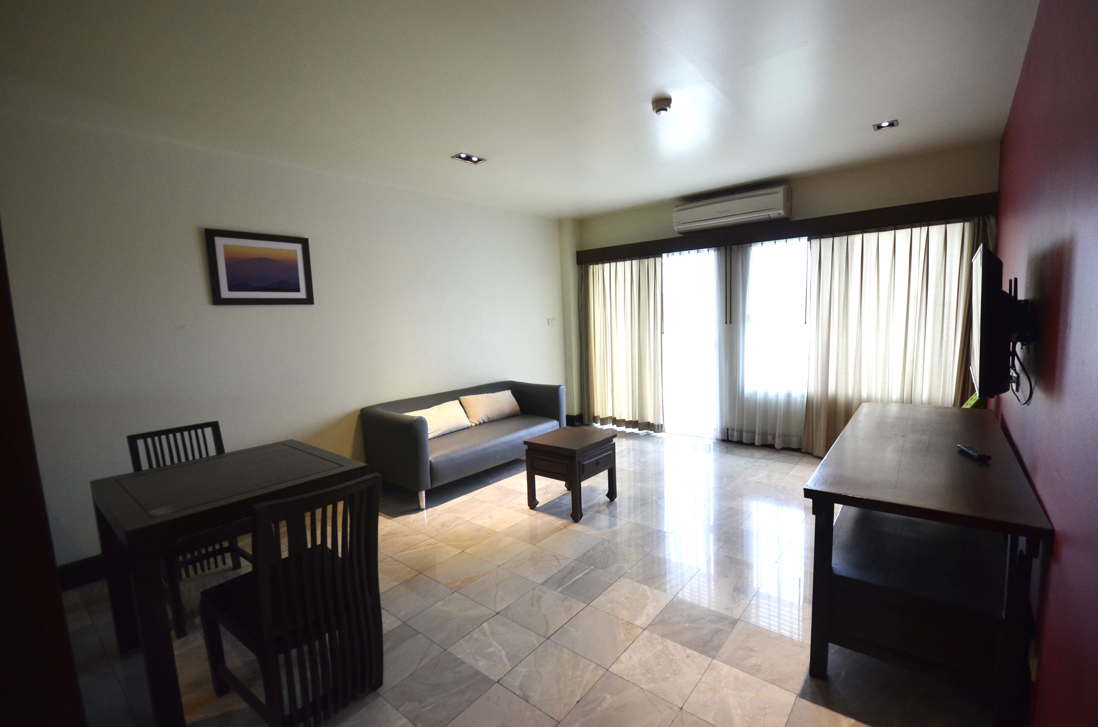 deluxe 1 bedroom apartment | living area | 42-inch led tv with digital channels, tv