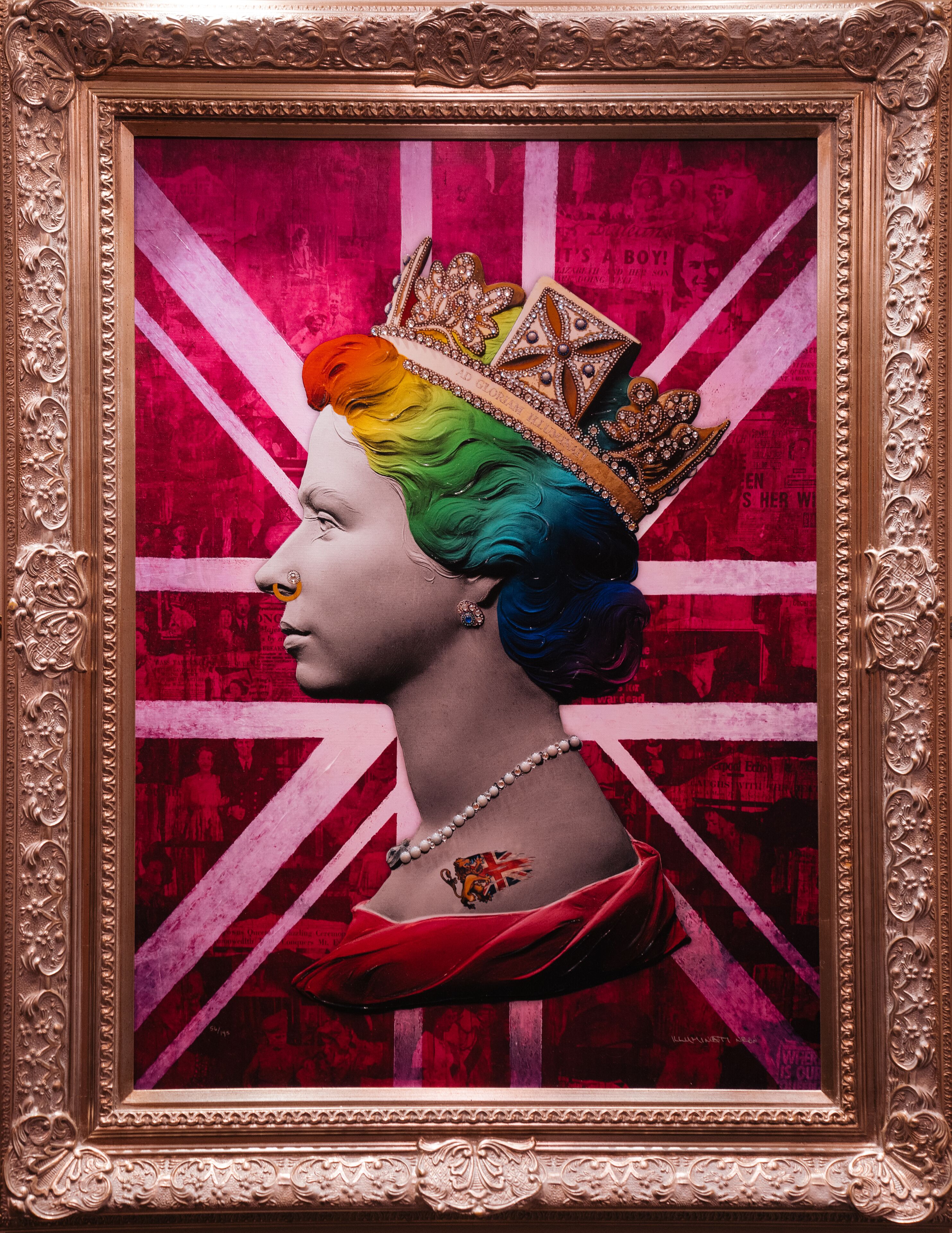 A portrait of a person wearing a crown and a necklace, framed in an ornate gold frame.