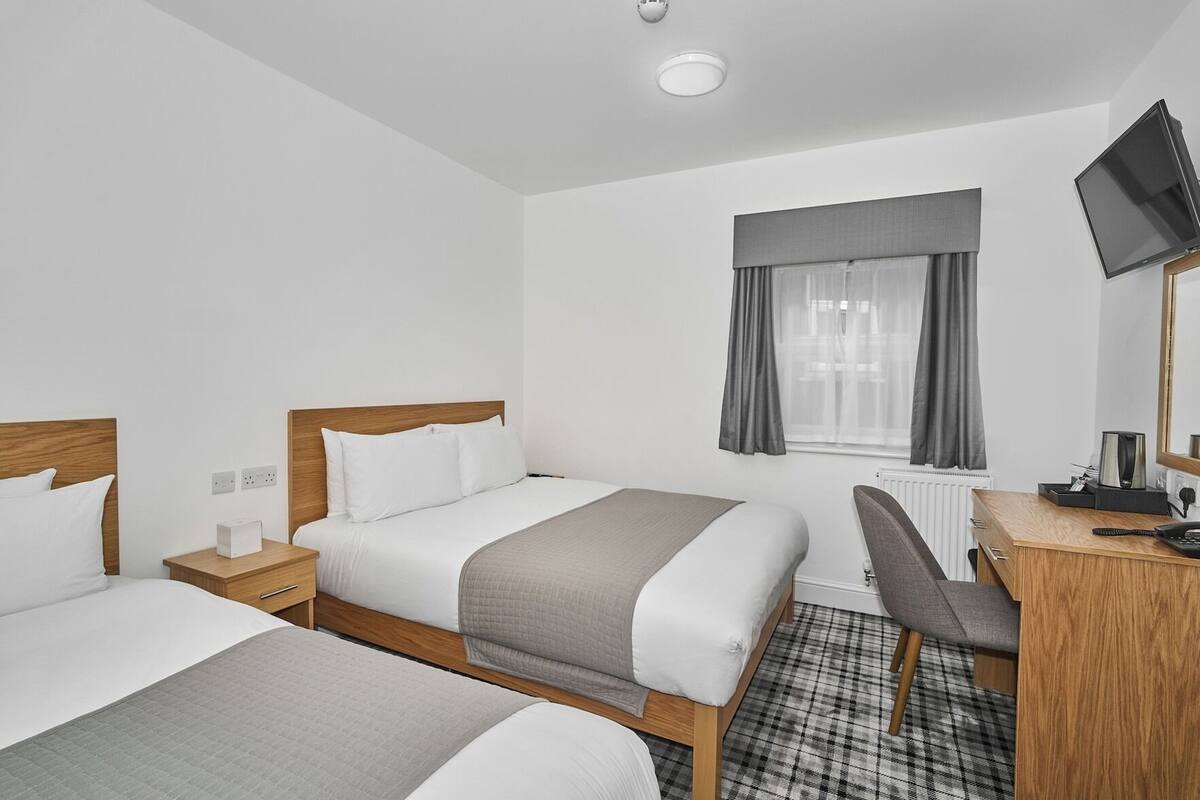 Desk, blackout curtains, iron/ironing board (on request), free WiFi