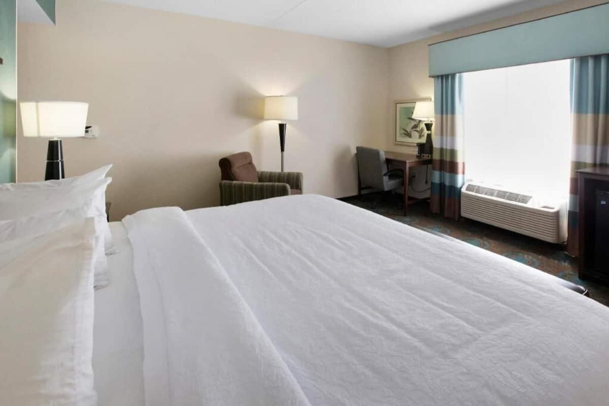 Desk, laptop workspace, blackout drapes, iron/ironing board