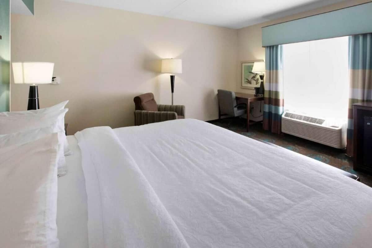 Desk, laptop workspace, blackout drapes, iron/ironing board