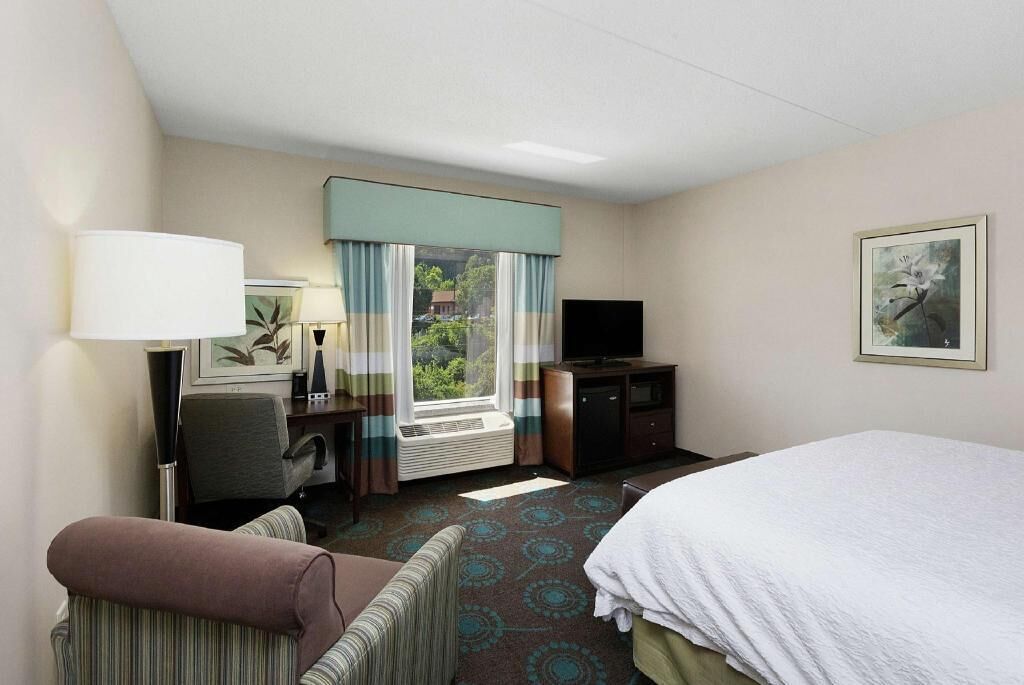 Desk, laptop workspace, blackout drapes, iron/ironing board