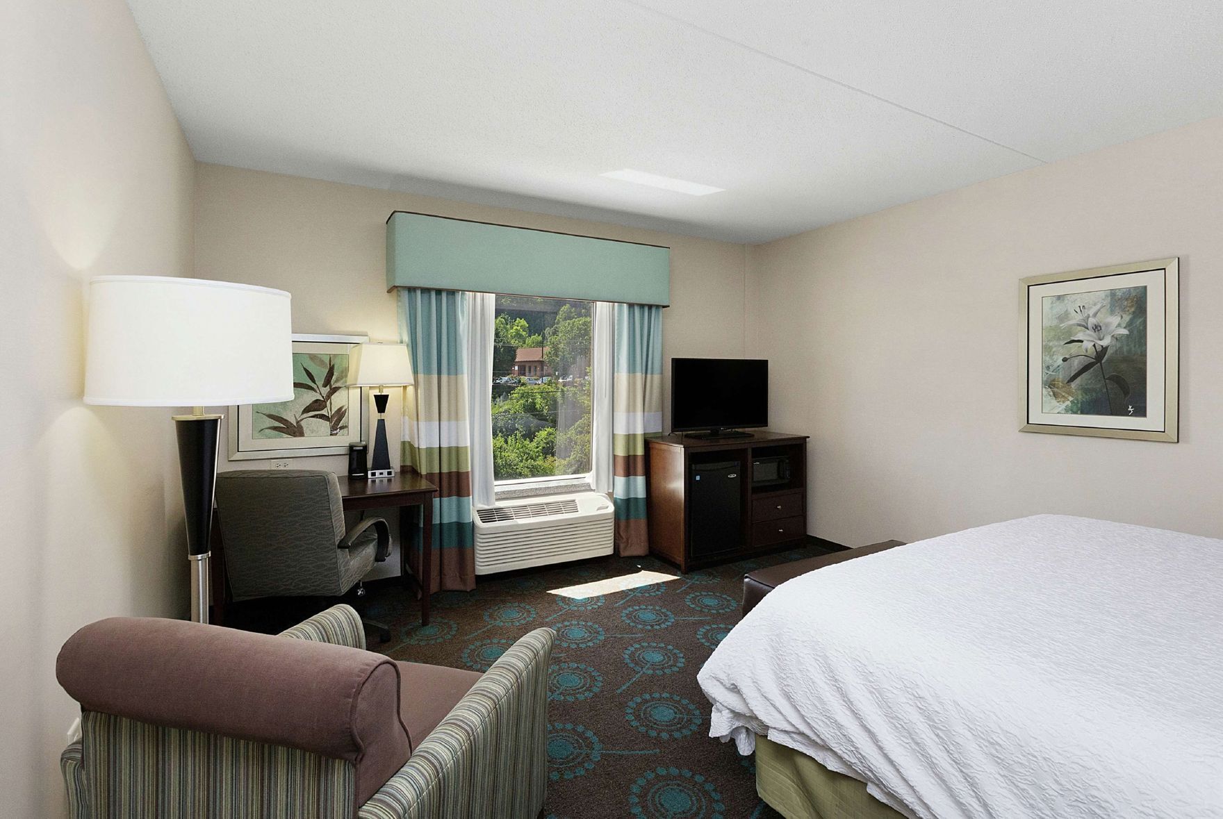 Desk, laptop workspace, blackout drapes, iron/ironing board