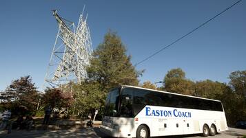 A bus with "Easton Coach" written on the side parked in a parking lot.