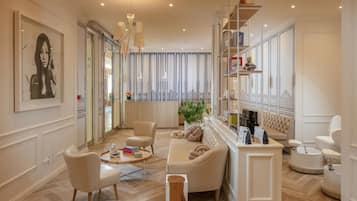 Relax in a stylish space with a plush sofa, coffee table, and reading nook.