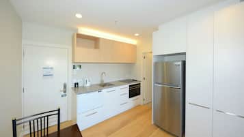 Standard One Bedroom Apartment | Private kitchen | Full-sized fridge, microwave, oven, stovetop
