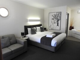 Premium Suite, 1 King Bed, Jetted Tub | 1 bedroom, Egyptian cotton sheets, pillowtop beds, minibar