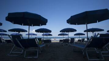 Private beach, sun-loungers, beach umbrellas, windsurfing