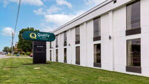 A modern building with a sign reading "Quality Inn by Choice Hotels." - Quality Inn - Roxboro South (Roxboro)