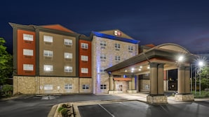 A multi-story hotel with a prominent entrance and a covered area. - Best Western Plus JFK Inn & Suites (North Little Rock)