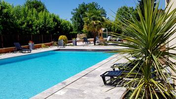 Outdoor pool, pool umbrellas, pool loungers