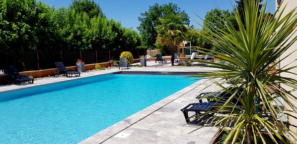Outdoor pool, pool umbrellas, pool loungers