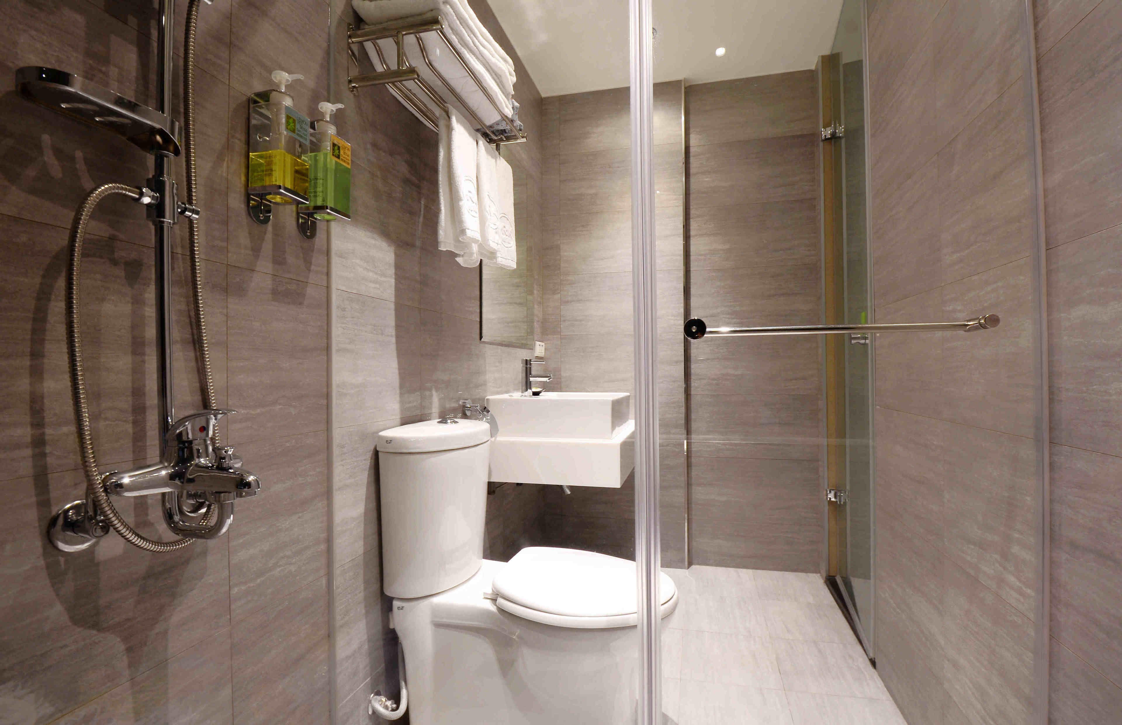 shower, hair dryer, slippers, towels