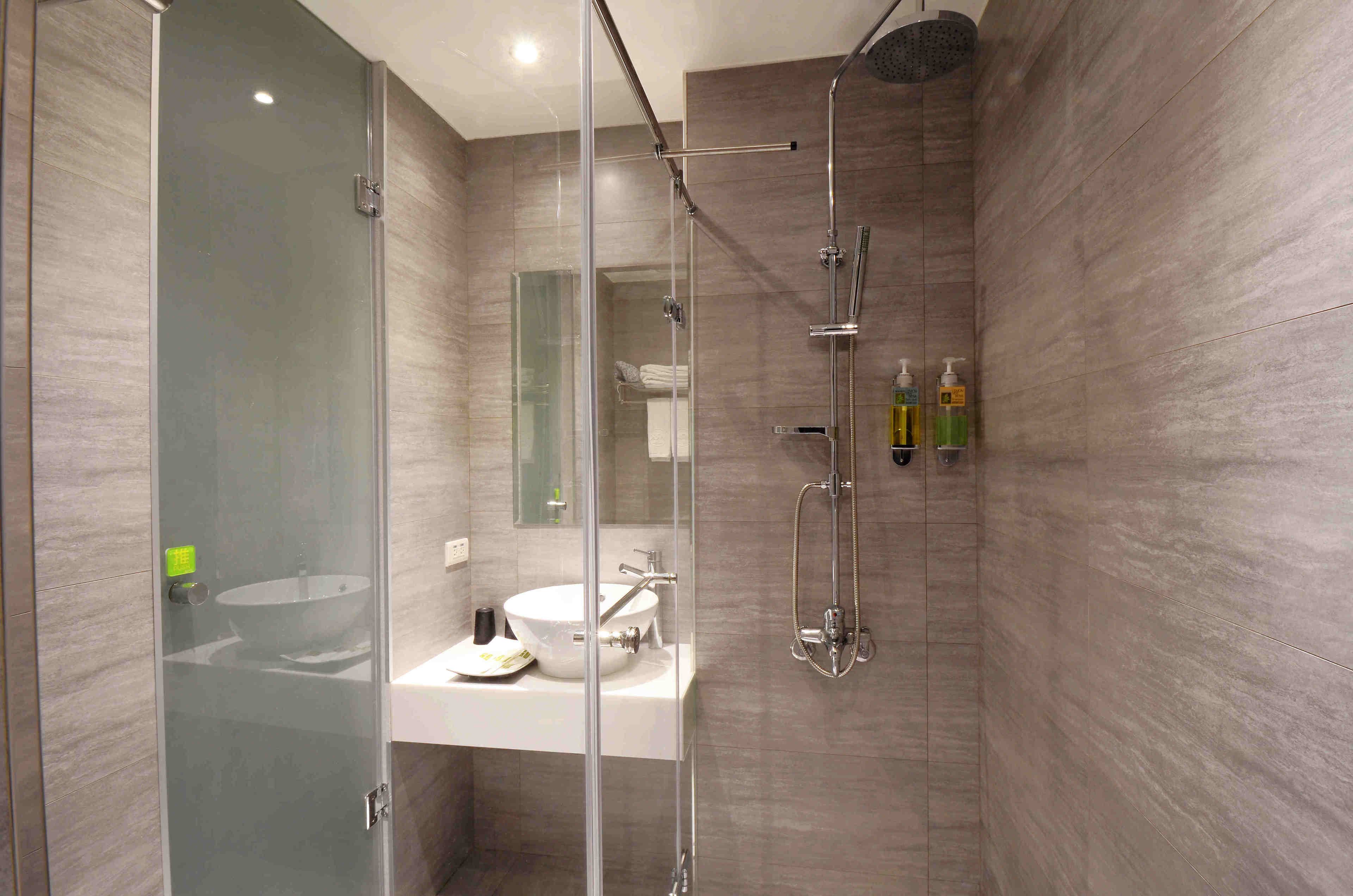 shower, hair dryer, slippers, towels