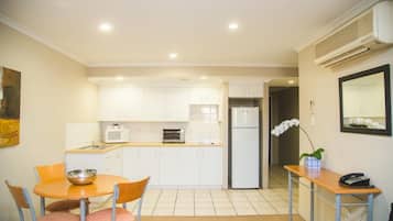 Deluxe One Bedroom Apartment | Private kitchen | Microwave, electric kettle, toaster