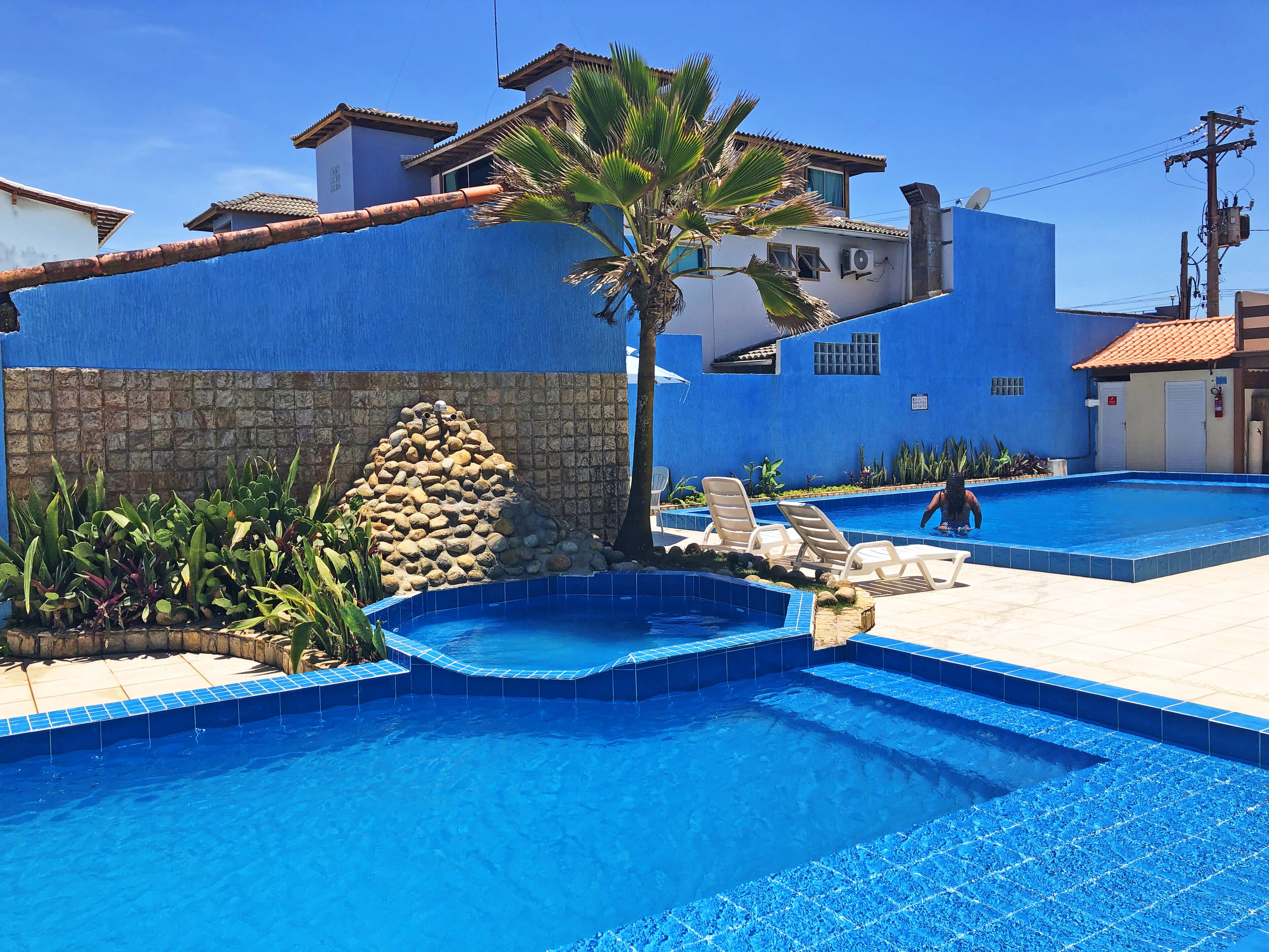 2 outdoor pools, pool umbrellas, pool loungers