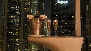 A modern hotel room with a view of the city skyline, including the Emaar building. - Sofitel Dubai Downtown (Dubai)