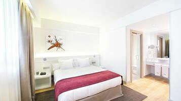 Luxe beddengoed, een minibar, een kluis op de kamer, een bureau