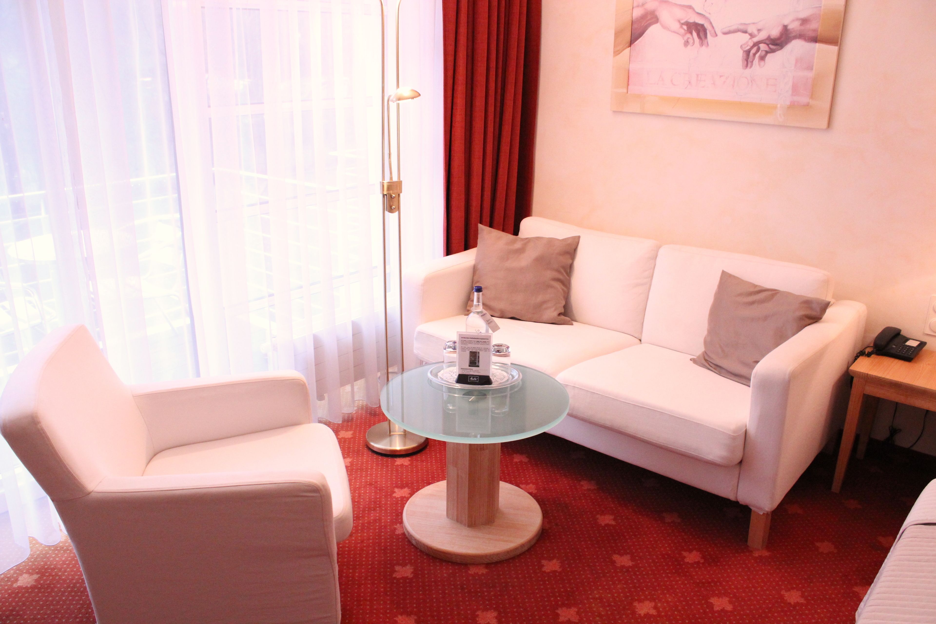 deluxe double room | living area | tv
