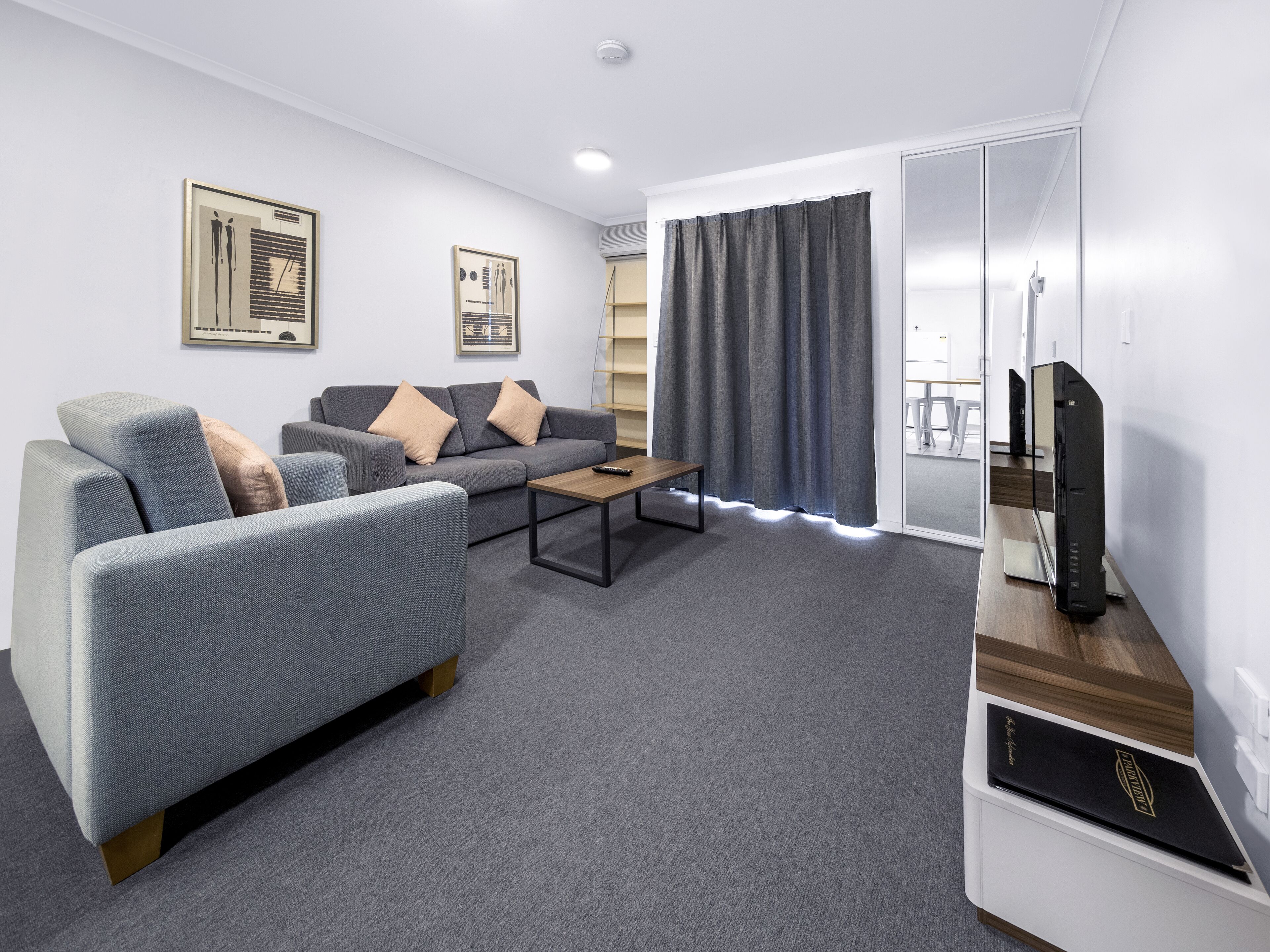 standard 1 bedroom apartment | living area | flat-screen tv