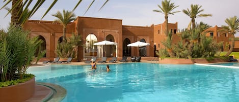 Outdoor pool, pool umbrellas, pool loungers
