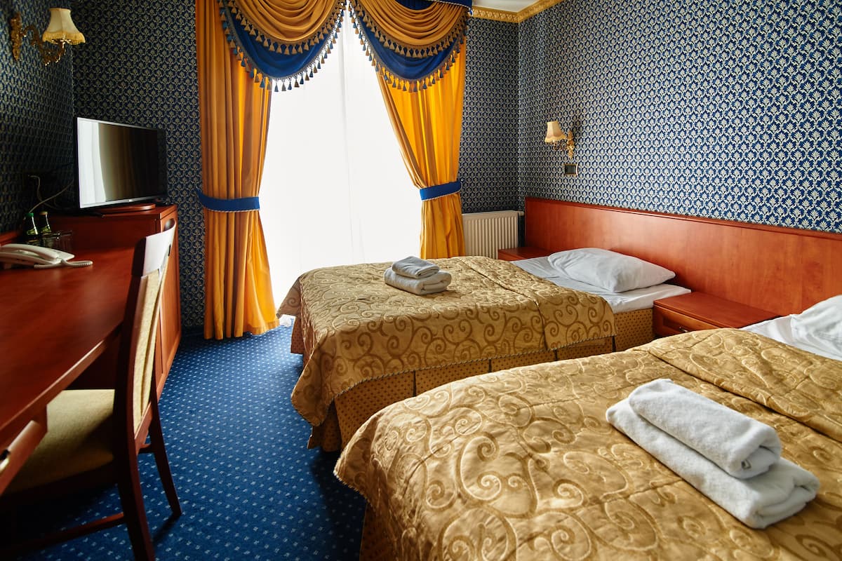 Camera Standard con letto matrimoniale o 2 letti singoli, 2 letti singoli, vista giardino | Biancheria da letto di alta qualità, materassi a doppio strato